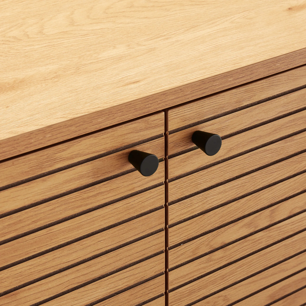 Zinc-plated fronts with black knobs of the LINNO S sideboard in oak by hjh LIVING