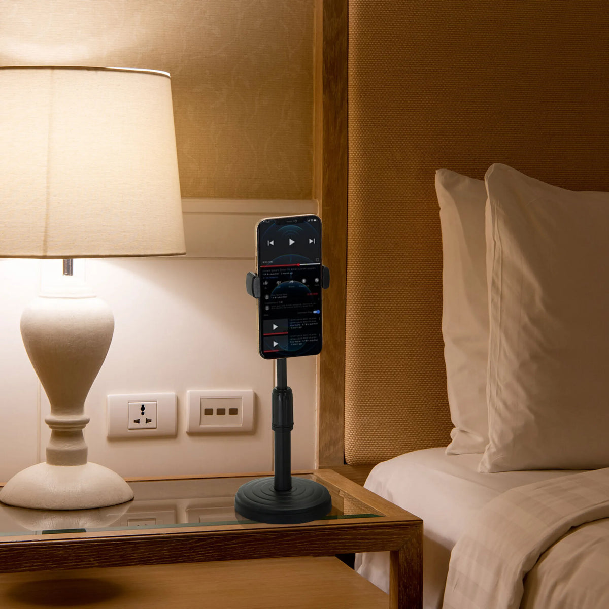 Black Mobile phone & tablet holder FLEXMOBI II with a smartphone on a bedside table by hjh OFFICE