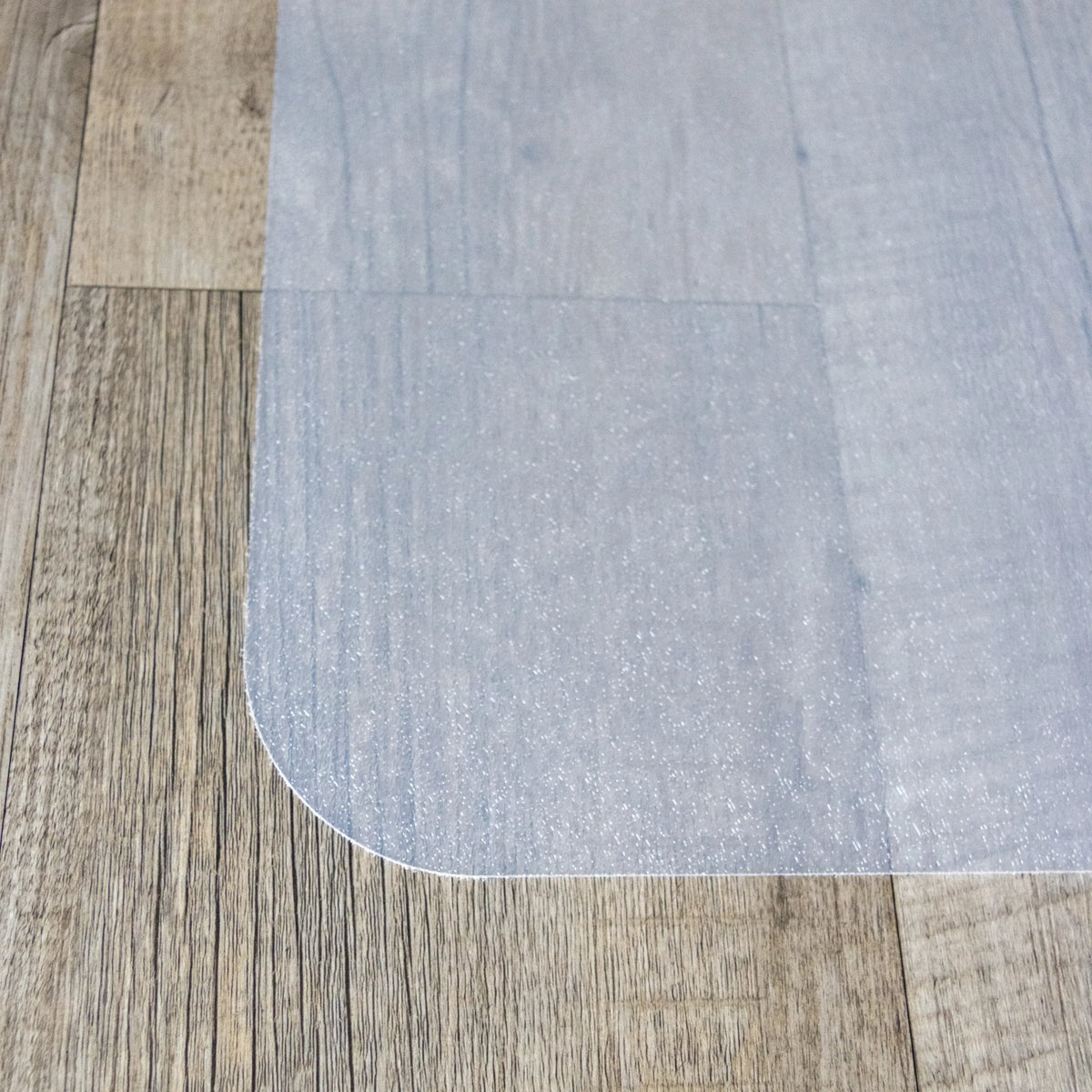 Rounded corner of the milky white Office Mat FORTIFLEX for hard floors by hjh OFFICE