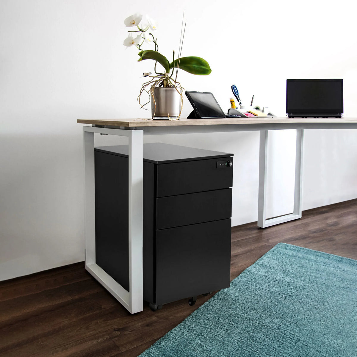 Black metal mobile drawer unit COLOR OS I under a desk with a light wood top by hjh OFFICE
