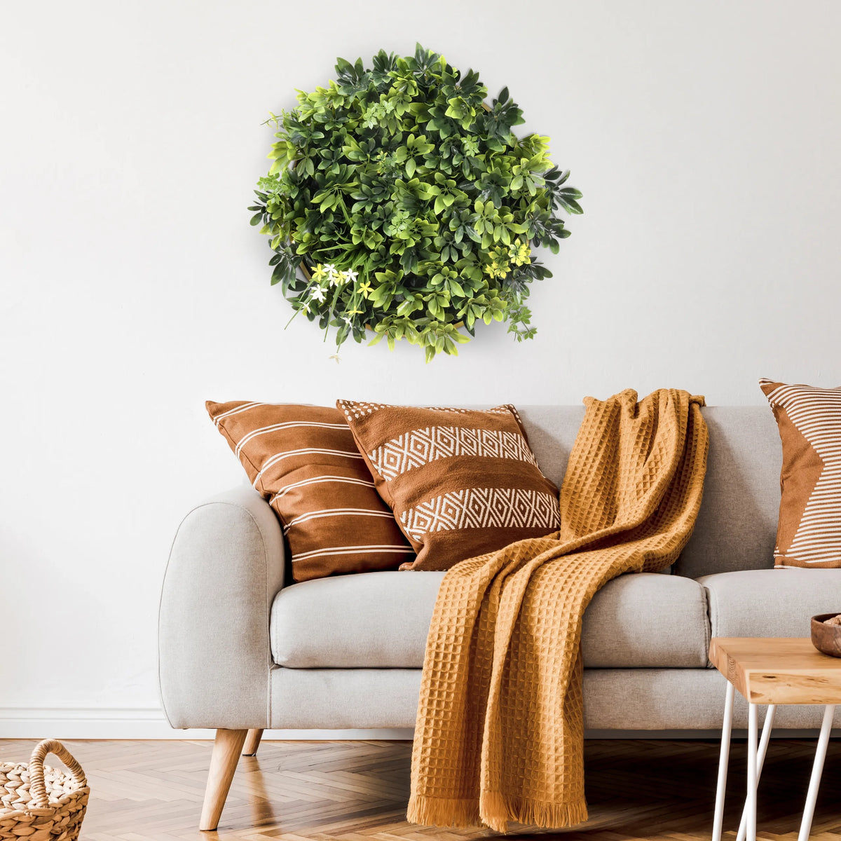 Green Plant mat LEAFLUXE WALL 2 as a circular wall decoration above a sofa by hjh LIVING