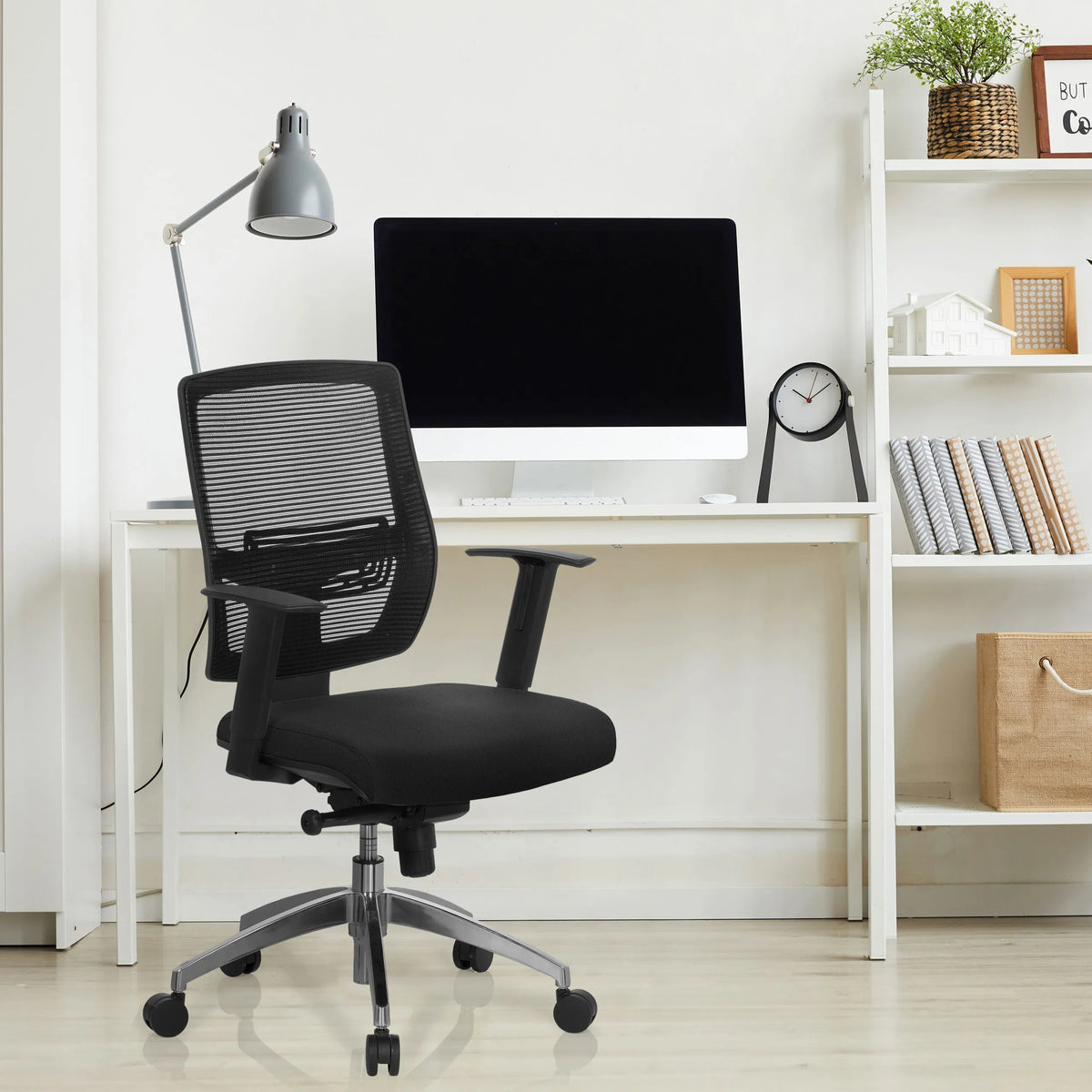 Black Professional Office Chair NET 90 with mesh backrest and armrests at a white desk by hjh OFFICE