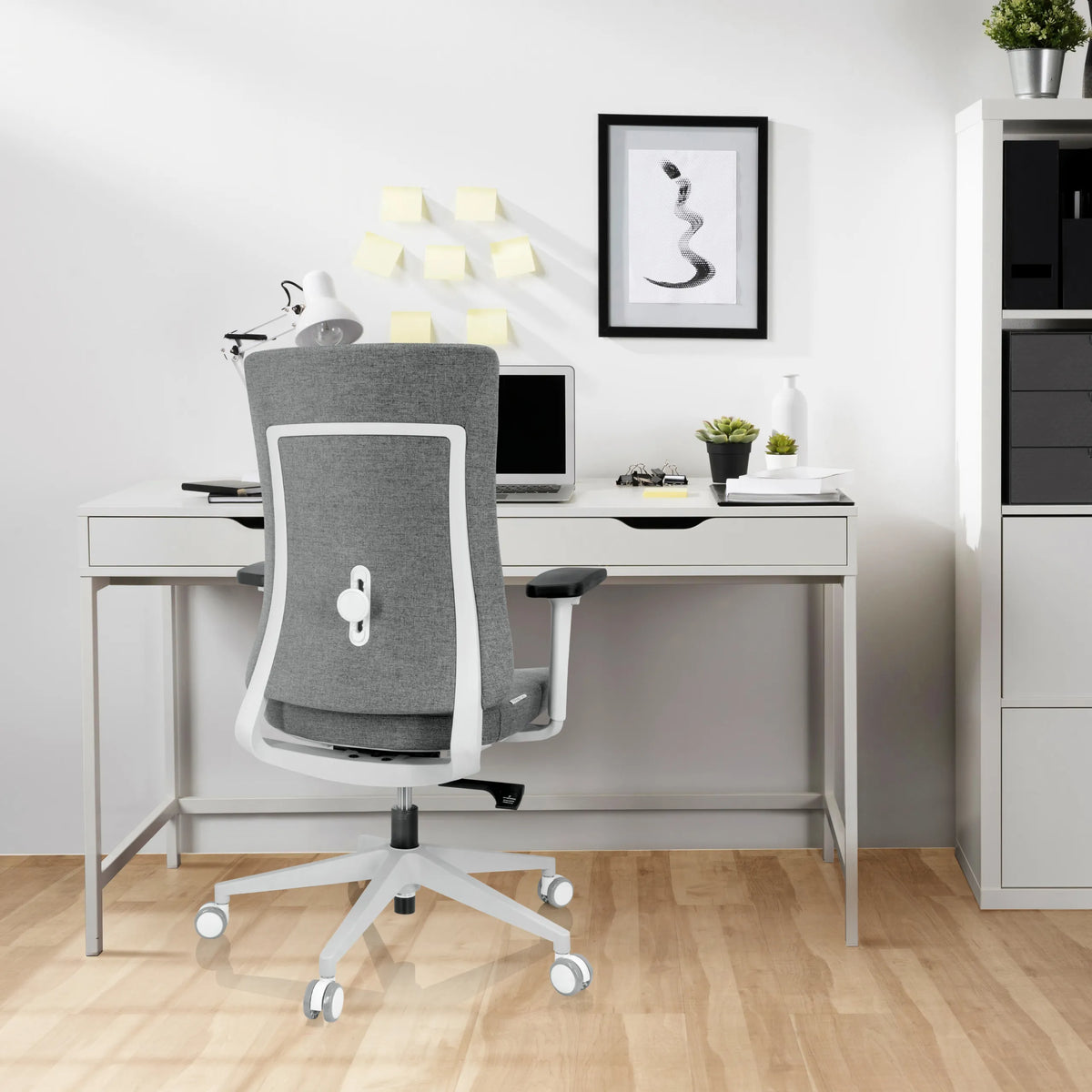 Grey Professional Office Chair COMFIO WP with white frame and castors in front of a desk by hjh OFFICE