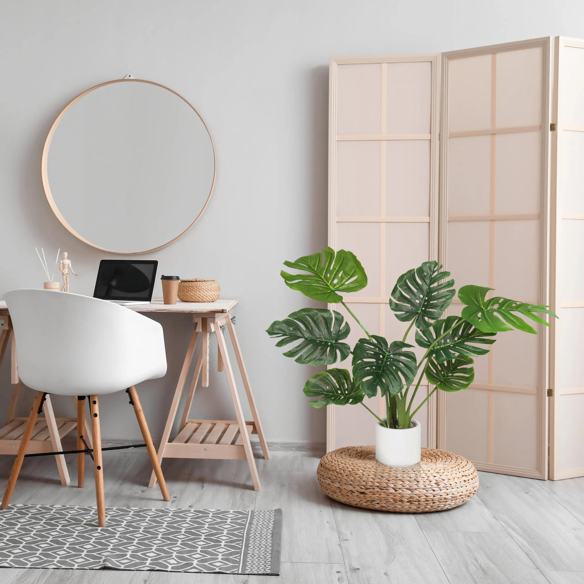 Green artificial plant MONSTERA I in a white pot on a woven pedestal by hjh OFFICE