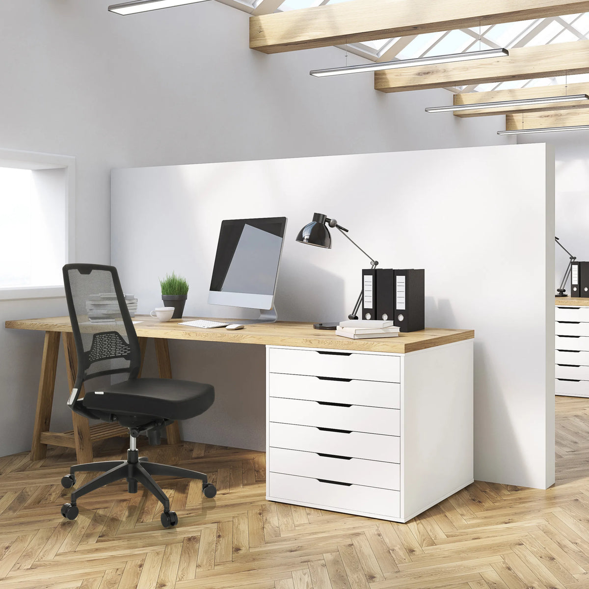 Professional Office Chair PORTO ECO I in black with a mesh backrest at a desk by hjh OFFICE