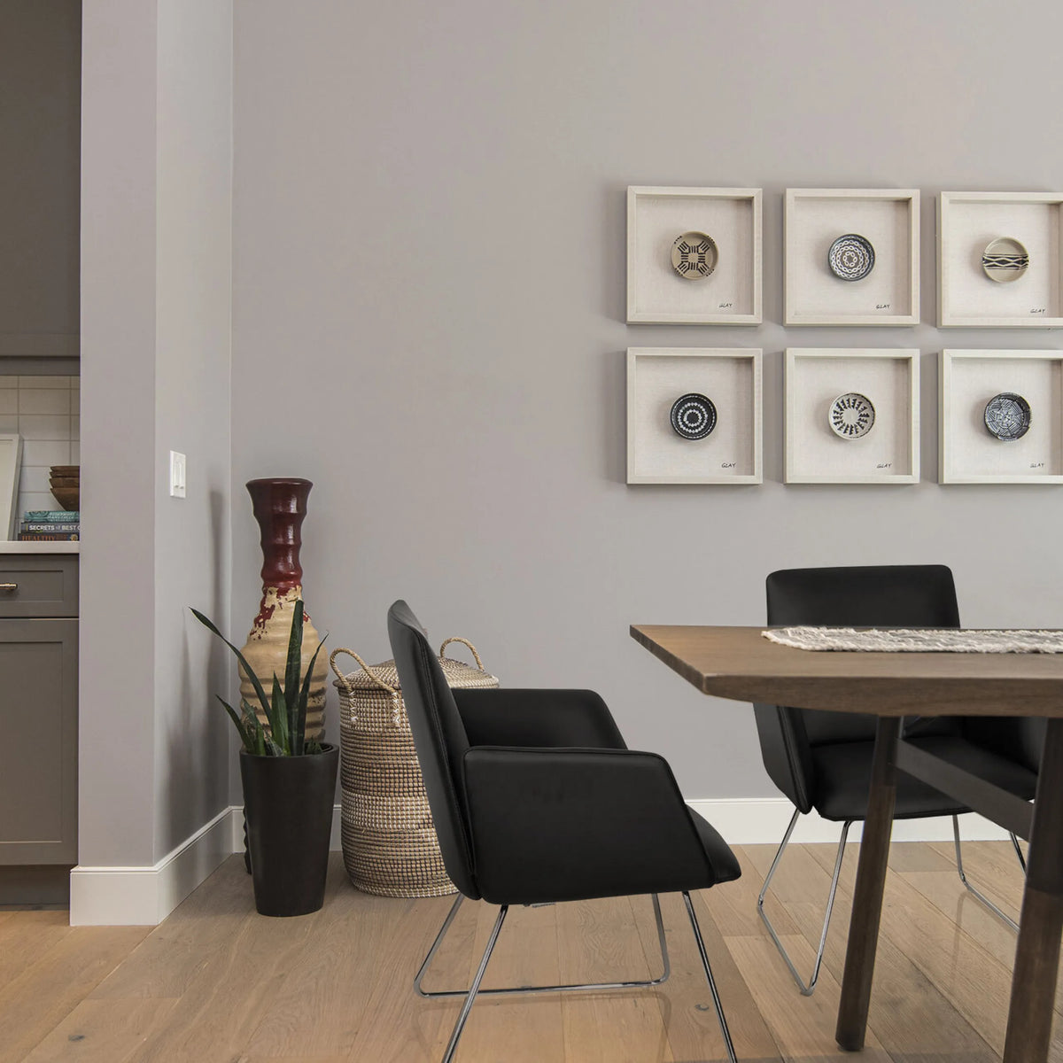 Black upholstered chair DESIGNIA V with slim metal legs at a wooden table by hjh OFFICE