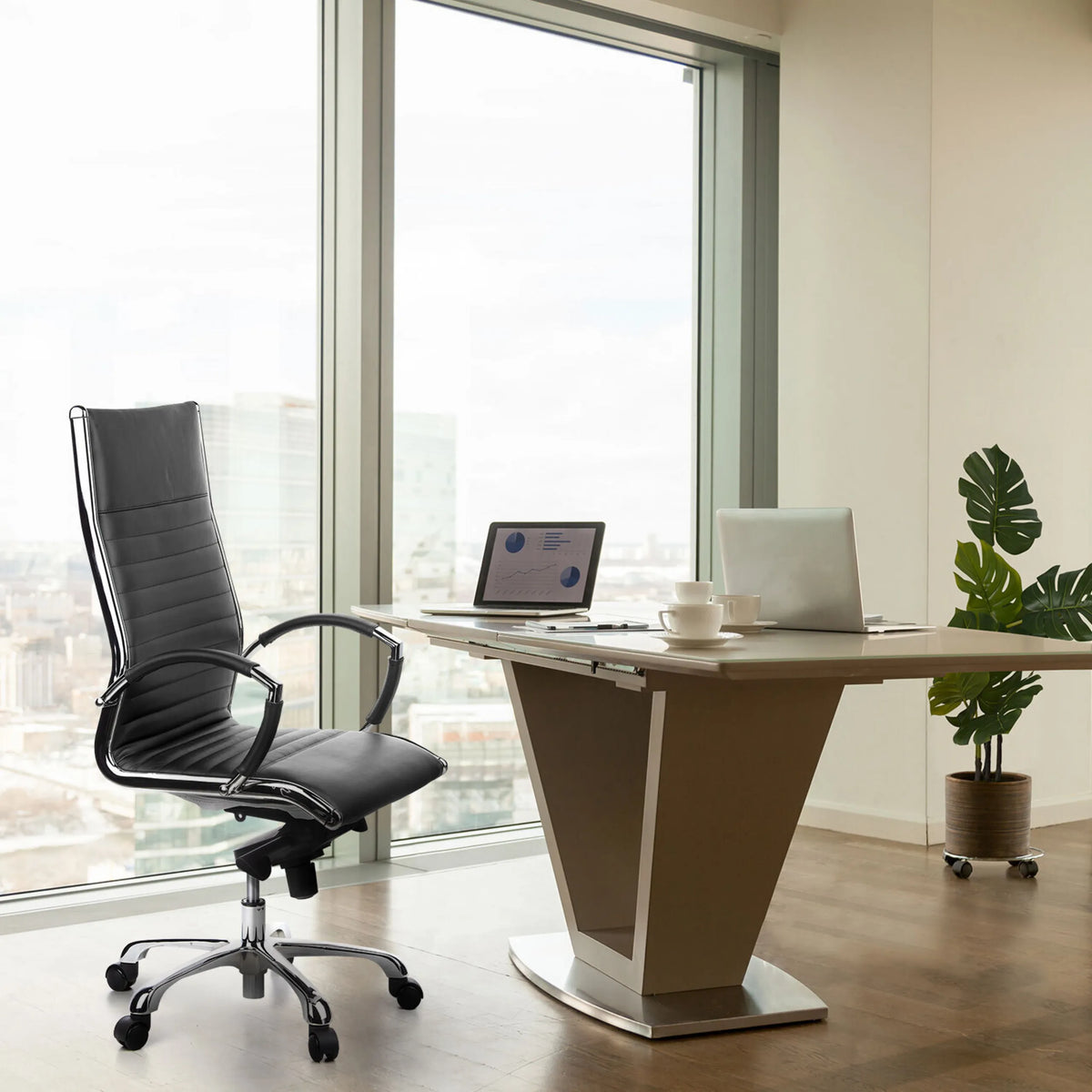 Professional Executive Chair PARMA 20 in black with quilted upholstery and a chrome base at a desk by hjh OFFICE