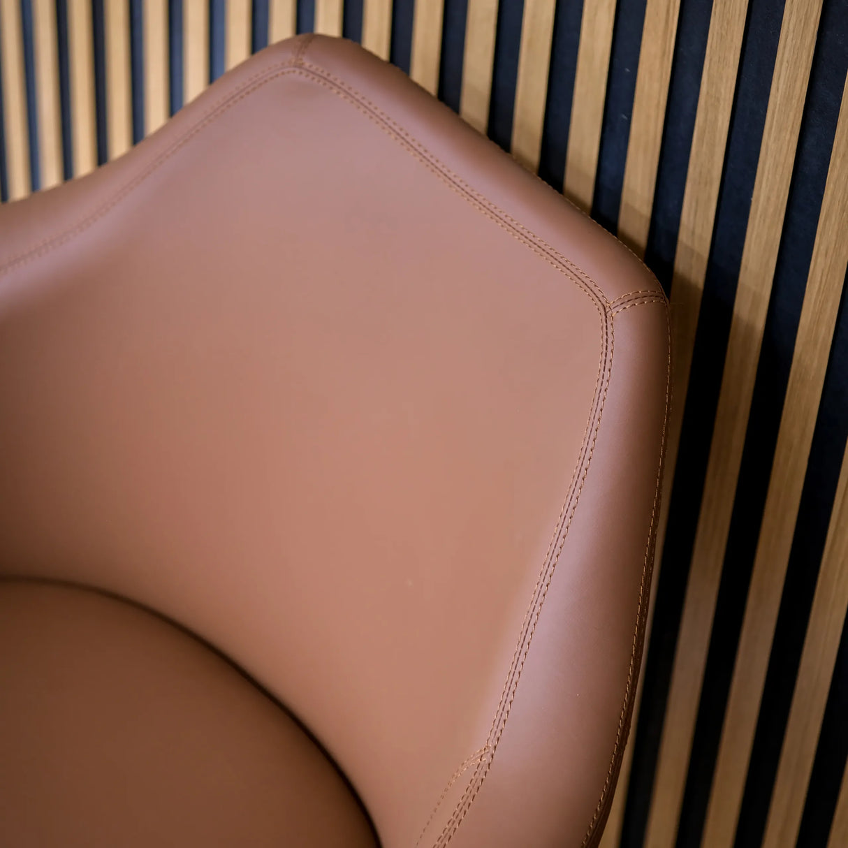 Brown leather upholstery of the backrest of the ARTEMIA lounge chair with visible seams by hjh OFFICE
