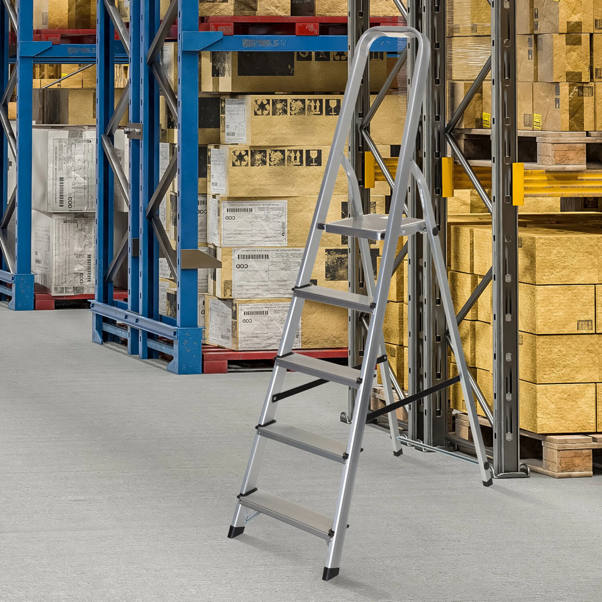 Five-step aluminium folding ladder SOLID III in a warehouse in front of a shelf by hjh OFFICE