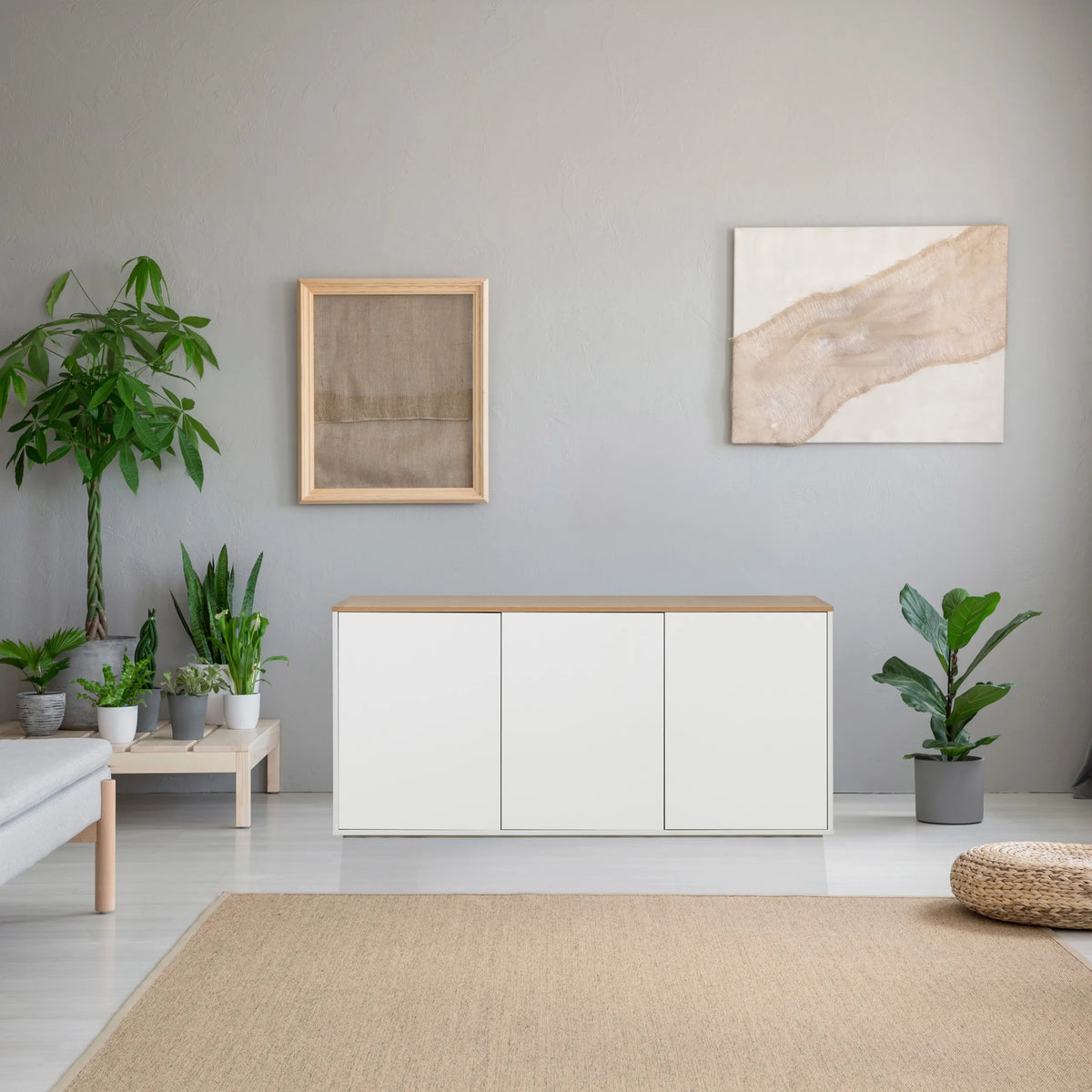 Sideboard KELO S in white with an oak top in a bright room by hjh LIVING