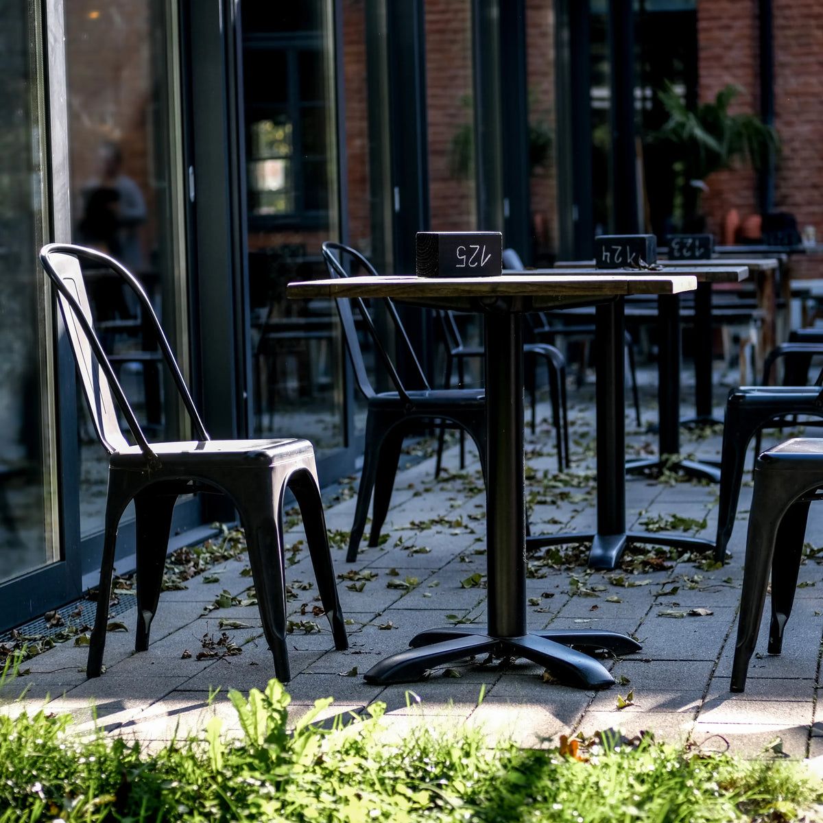 Black Bistro chair VANTAGGIO BRUSH with matching table in an outdoor area by hjh OFFICE