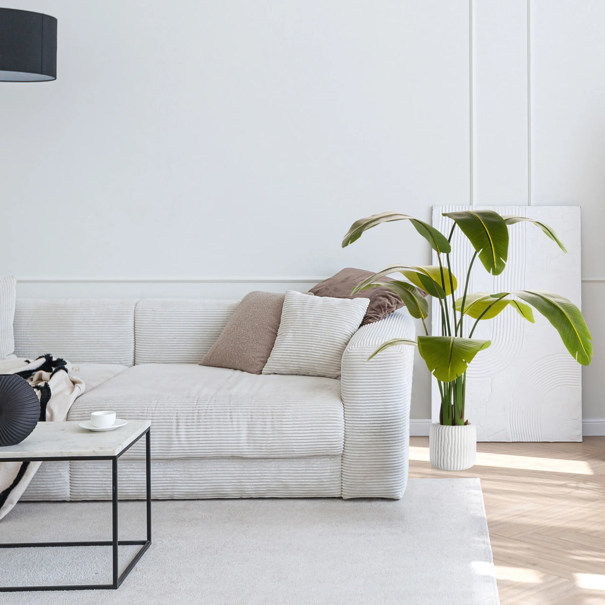 Green Artificial plant BANANE in a white pot next to a sofa by hjh OFFICE