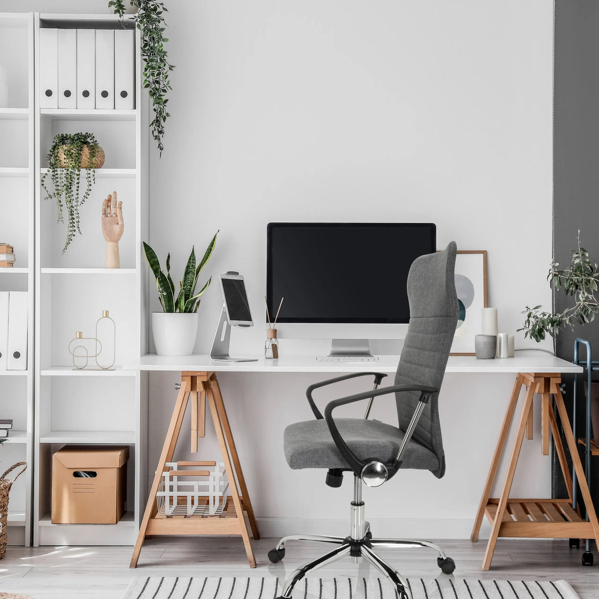 Grey Home Office Chair ARTON 40 with armrests and castors in front of a desk by hjh OFFICE