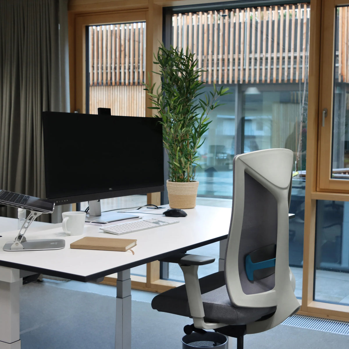 Grey HALIFAX WORK counter chair at a white desk in a bright room by hjh OFFICE