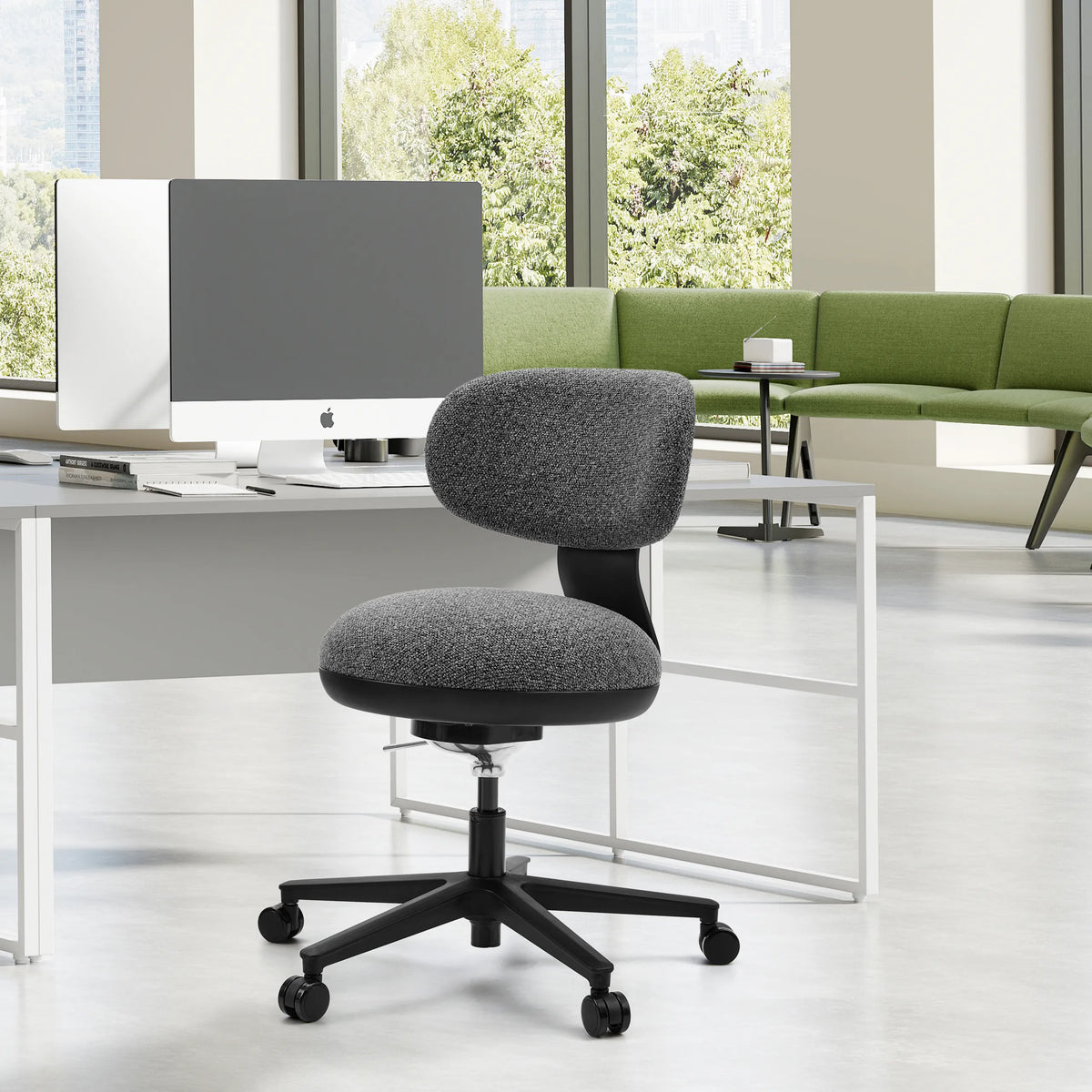 Grey SITMOTION B home office chair with castors in front of a white desk in a bright office by hjh OFFICE