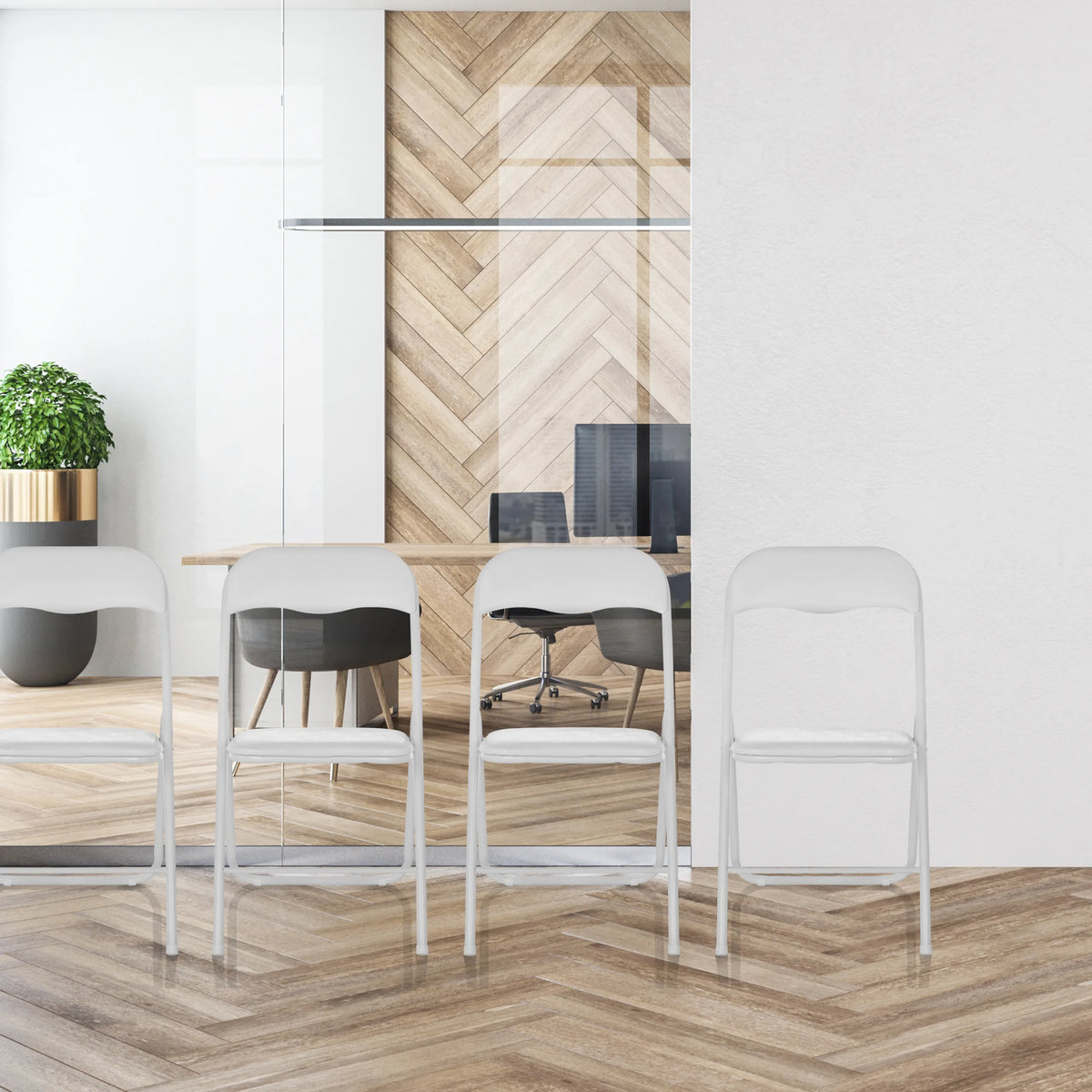 Four white PVC folding chairs TUDELA BASIC in a row in front of a glass wall by hjh OFFICE