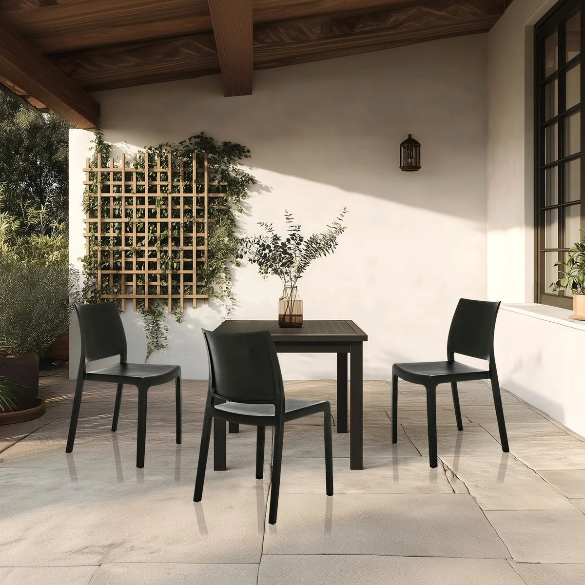 Three black outdoor chairs T37 V with matching table on a terrace by hjh LIVING