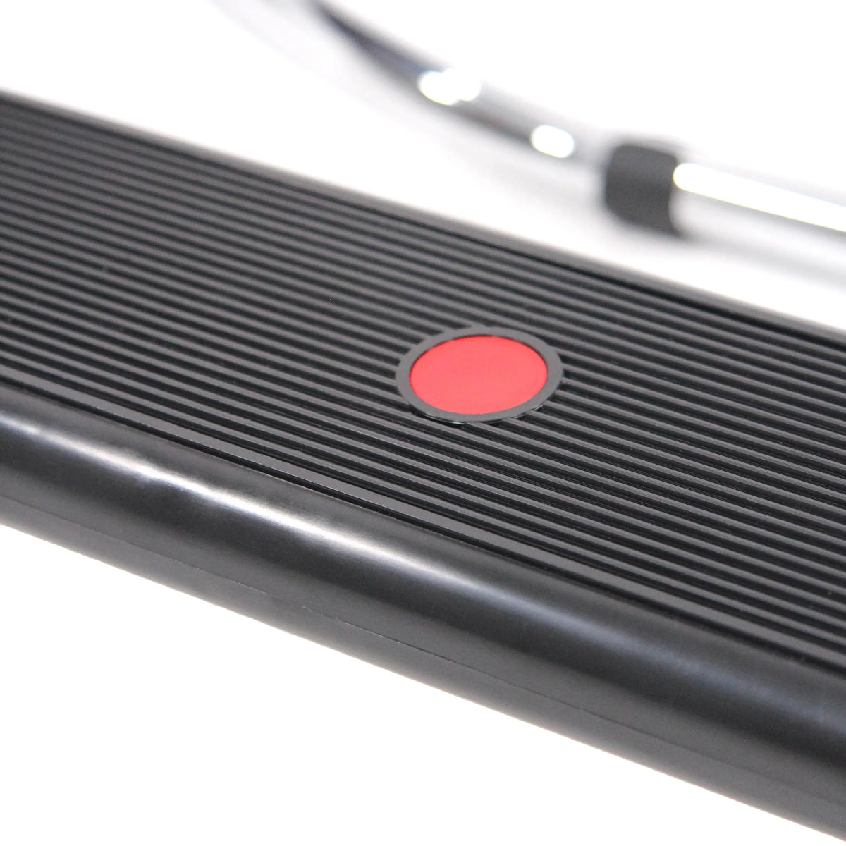 Red printed area on the ribbed black surface of the PODI IV footrest by hjh OFFICE