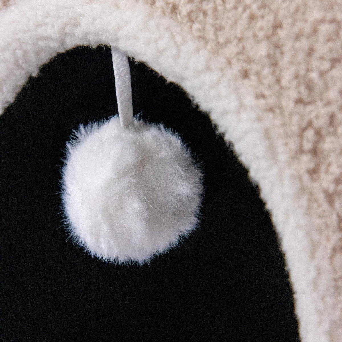 White pompom on a beige cat cave PAWY EB by hjh LIVING