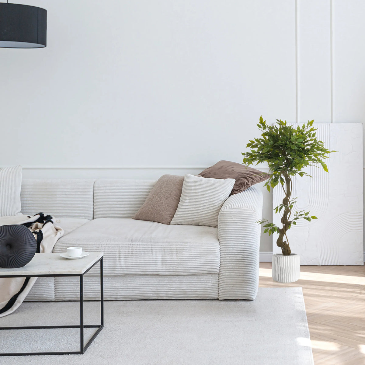 Green artificial plant FICUS I in a white pot next to a sofa by hjh OFFICE