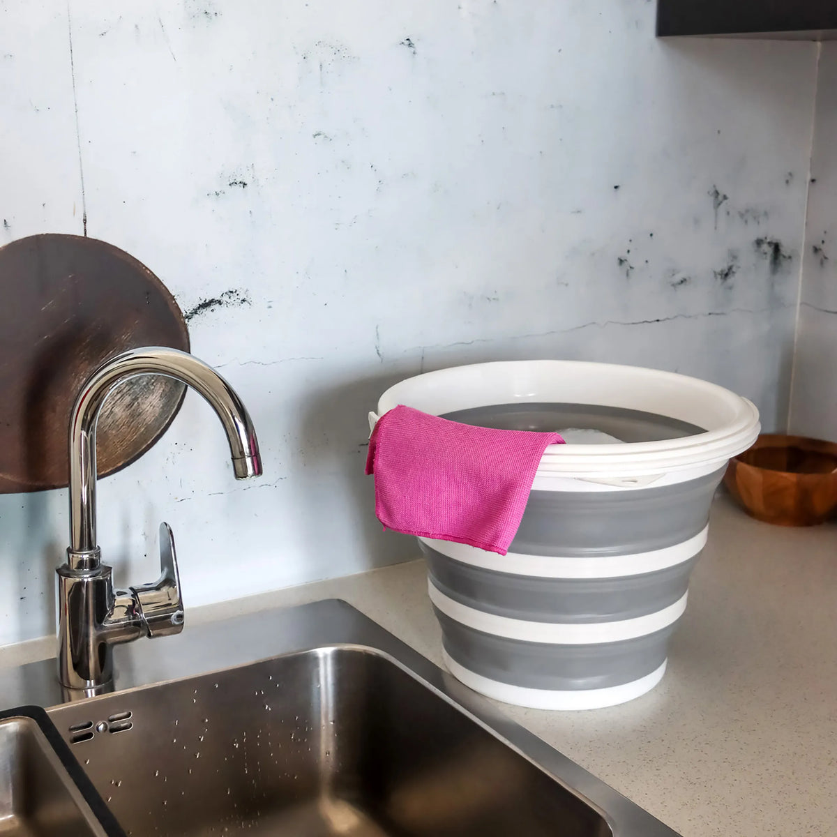 Grey and white Folding container CLEAN SILR with a pink cloth on a work surface next to a sink by hjh OFFICE