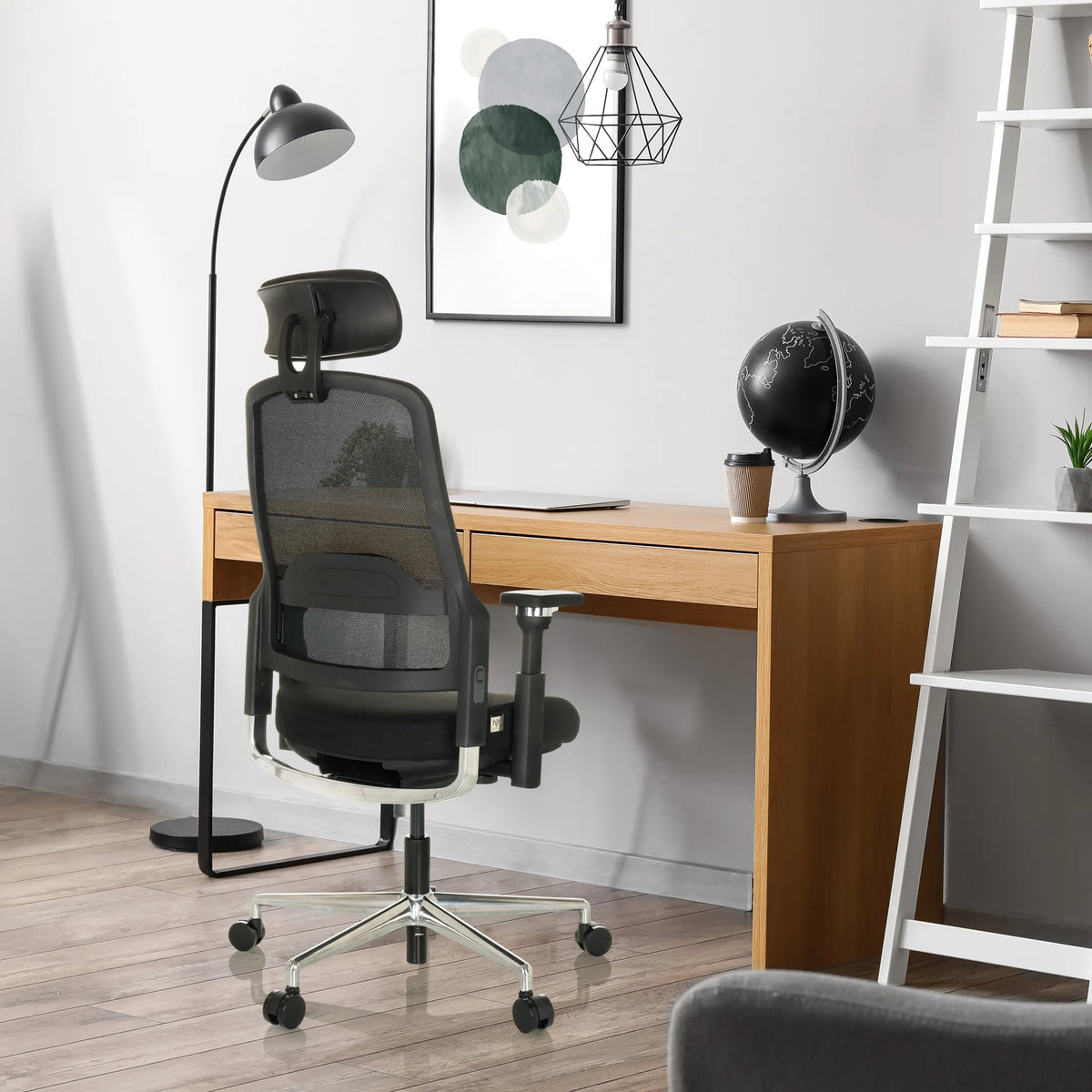 Black Professional Office Chair TERARO AX with mesh backrest and headrest in front of a desk by hjh OFFICE