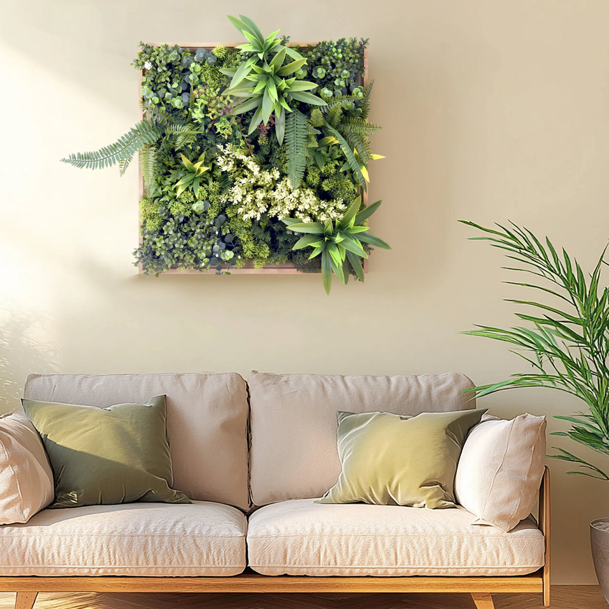 Green plant mat LEAFLUXE WALL 1 as a square wall art piece above a sofa by hjh LIVING