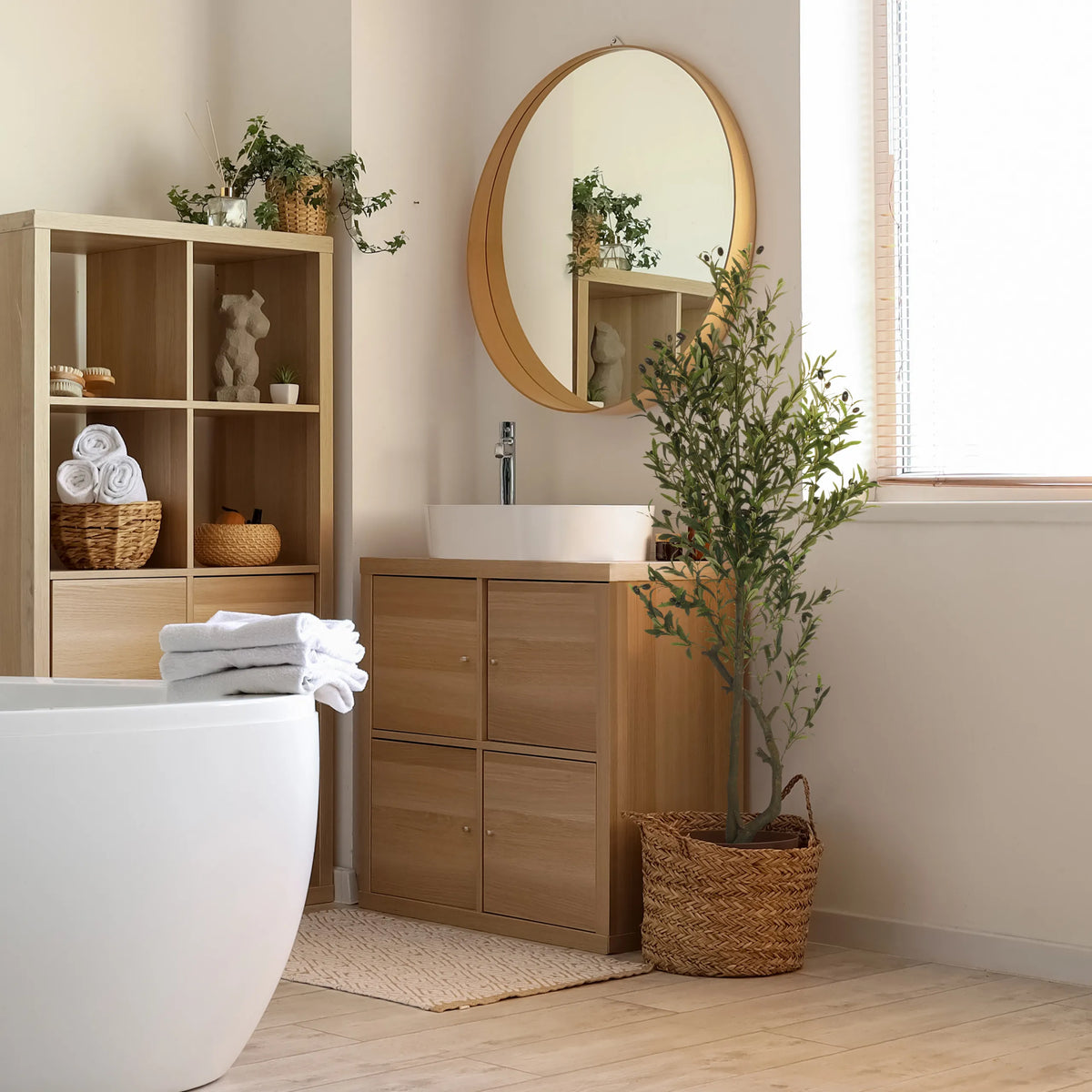 Green Artificial plant OLIVE I in a woven basket in the bathroom by hjh OFFICE