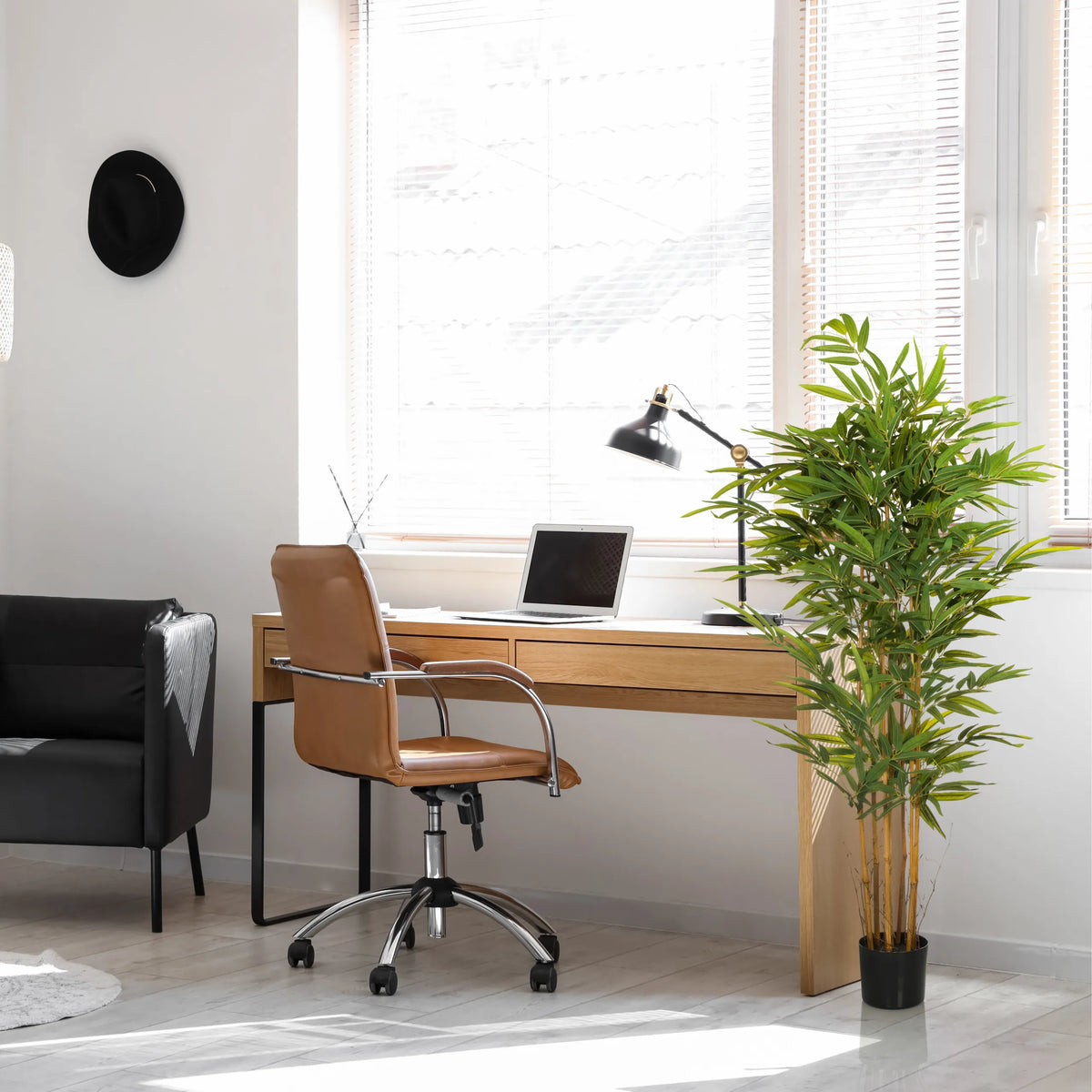 Green Artificial plant BAMBUS II in a black pot in a home office by hjh OFFICE