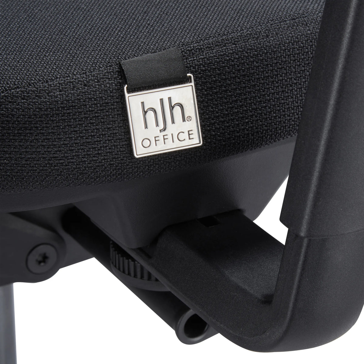 Silver-coloured logo plaque on the black fabric upholstery of the Skandis Pro Professional Office Chair by hjh OFFICE