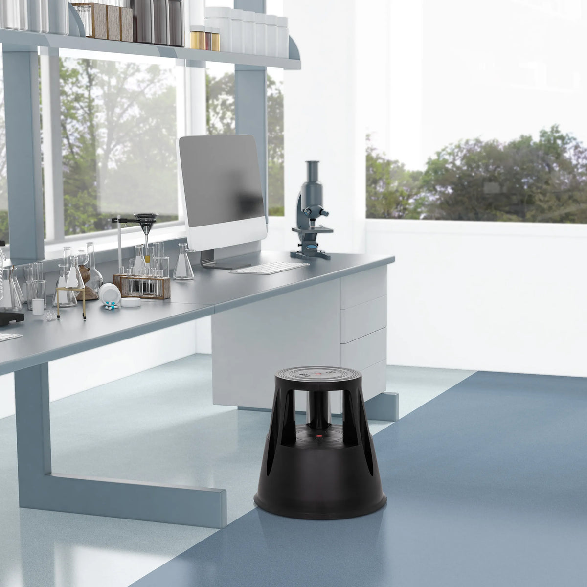 Black Step stool TIO-M I in front of a laboratory table in a bright room by hjh OFFICE