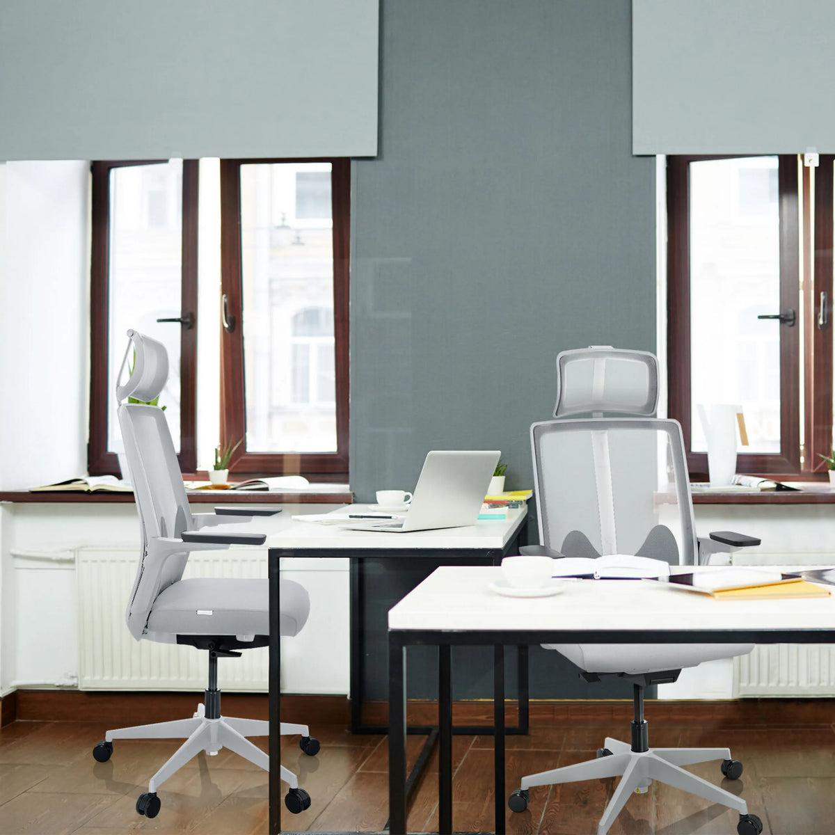 Two grey Professional Office Chairs ARCEO W at white desks in an office by hjh OFFICE