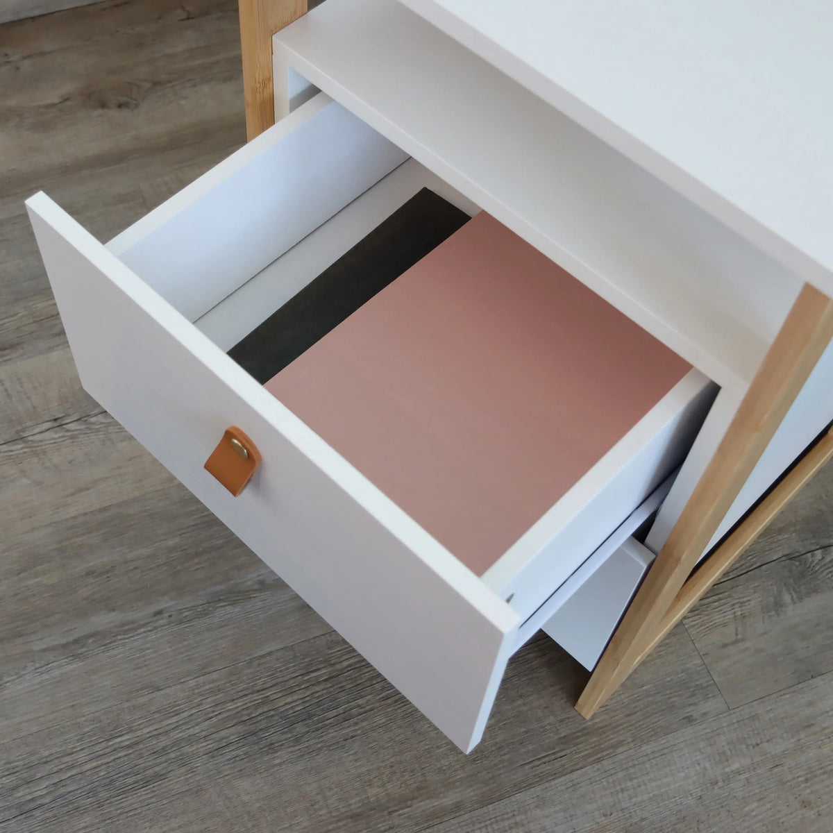 Open white drawer with brown leather handle of the Side table TAROLO III by hjh LIVING
