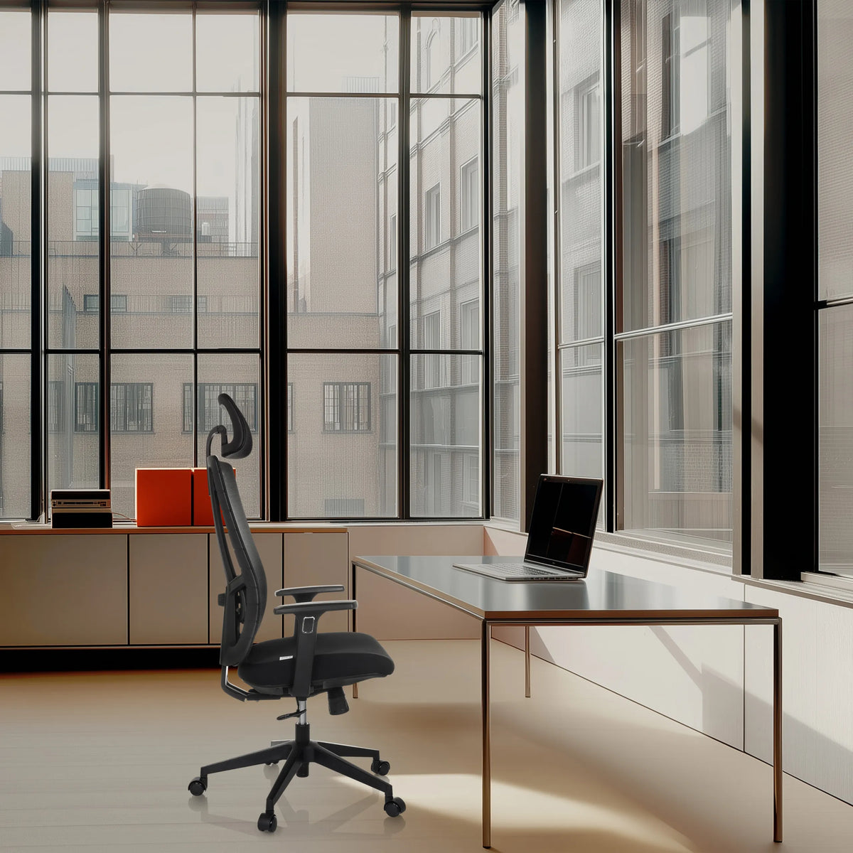 Black Professional Office Chair TRAMORE with headrest and armrests at a desk in front of a window by hjh OFFICE