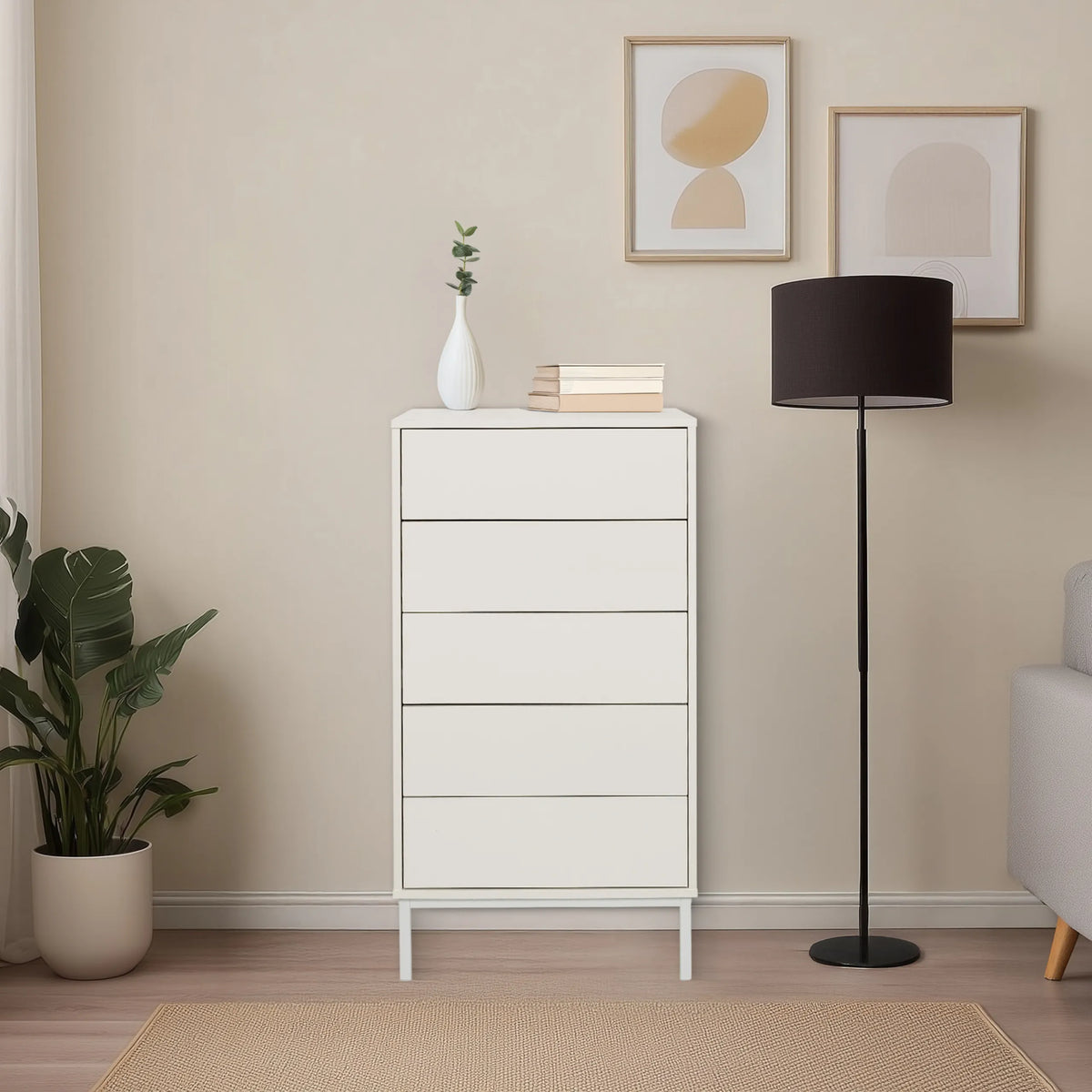 White BJORDAL chest of drawers with five drawers on slim legs in a bright room by hjh LIVING