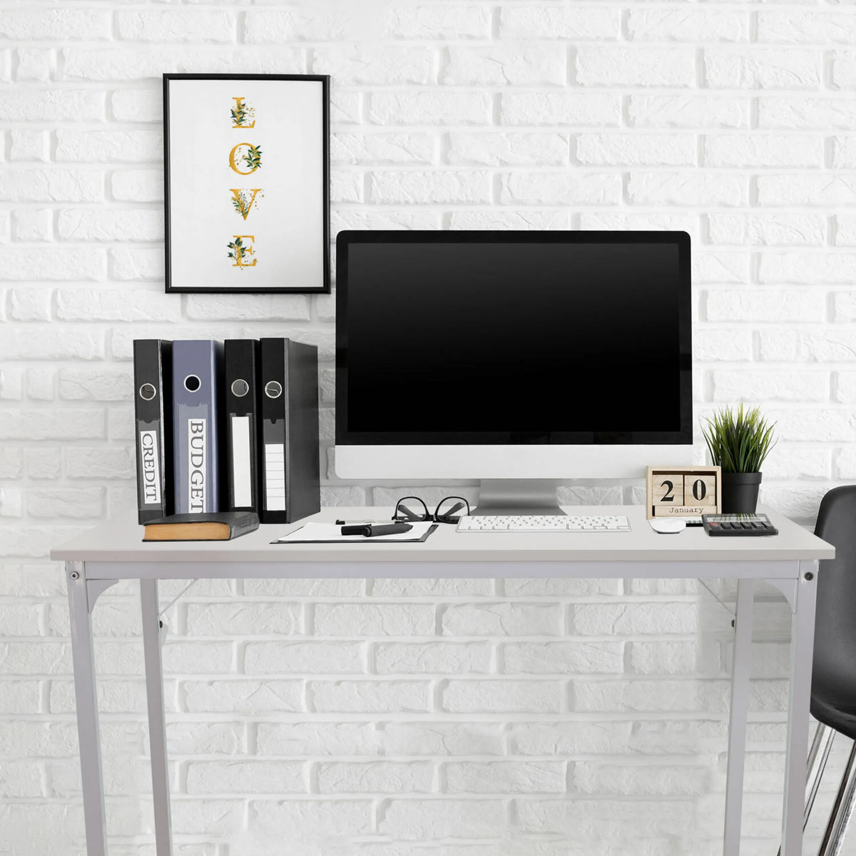 White office desk WORKSPACE I measuring 100 × 50 cm in front of a white brick wall by hjh OFFICE