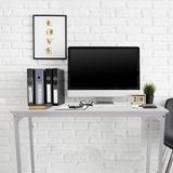 White office desk WORKSPACE I measuring 100 × 50 cm in front of a white brick wall by hjh OFFICE