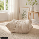 Beige Sitzolo Podi beanbag with quilted structure on a light-coloured rug by hjh LIVING (AI-generated image)