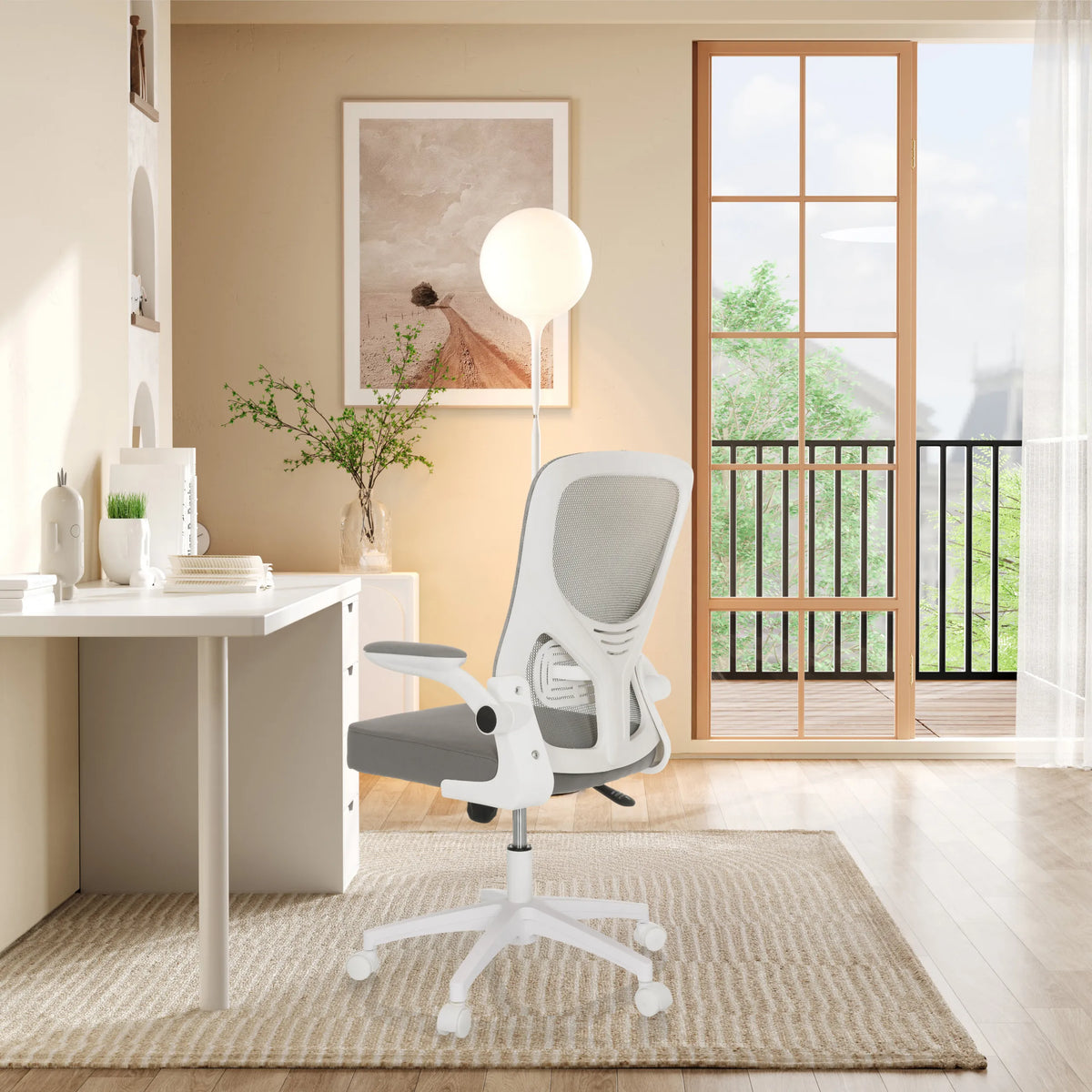 Grey BELIO W home office chair with mesh backrest and white armrests in a bright room by hjh OFFICE
