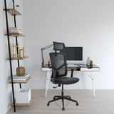 Black BRETON B home office chair with mesh backrest, headrest and castors in front of a desk by hjh OFFICE