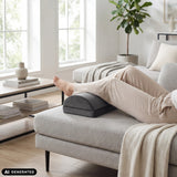 Black Podi Velvet 1 footrest under a person's legs on a sofa by hjh OFFICE (AI-generated image)