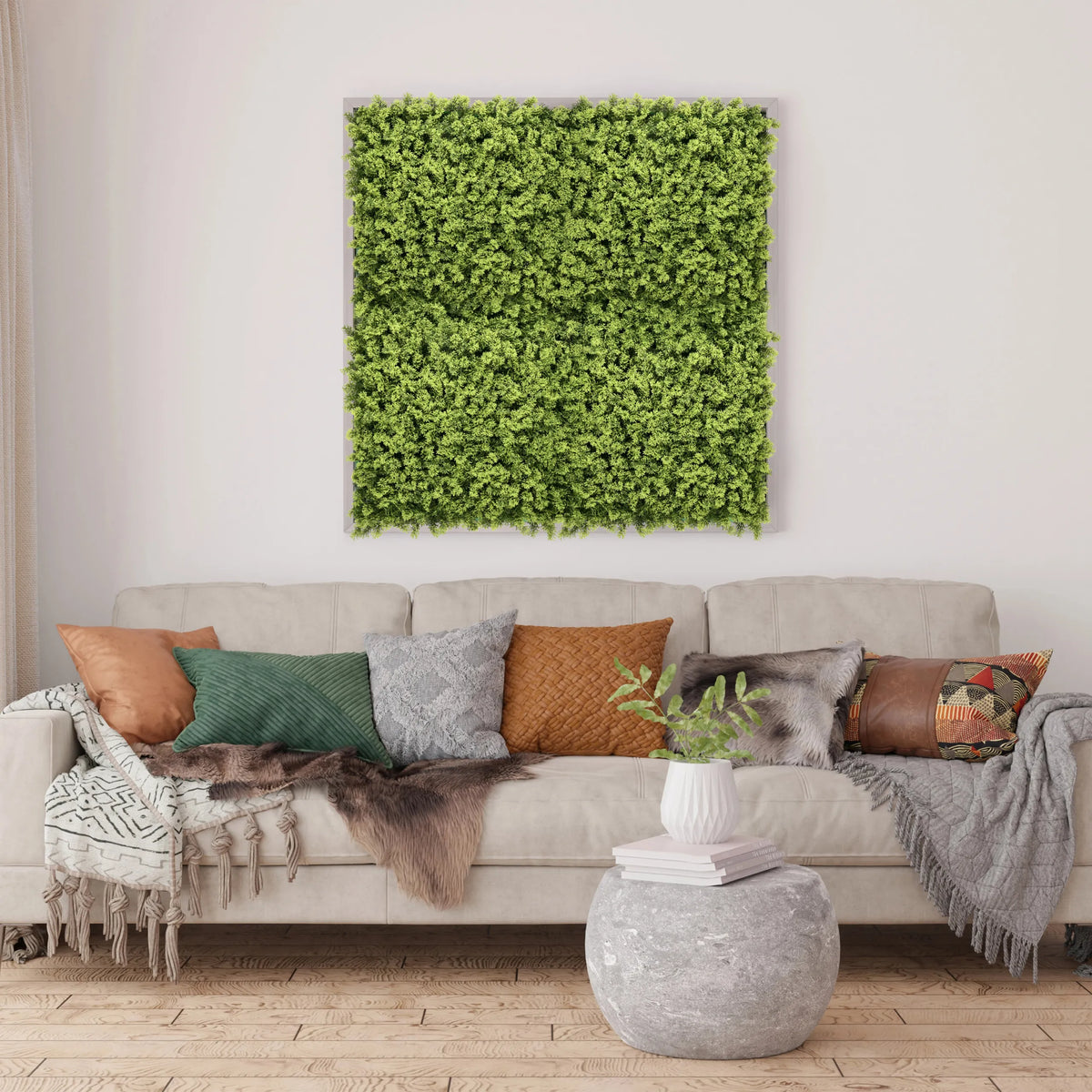 Green plant mat LEAFLUXE 3 as a square wall art piece above a sofa by hjh LIVING