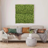 Green plant mat LEAFLUXE 3 as a square wall art piece above a sofa by hjh LIVING