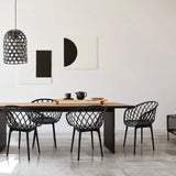 Four black BEGIO B shell chairs with mesh backrests at a dining table by hjh OFFICE