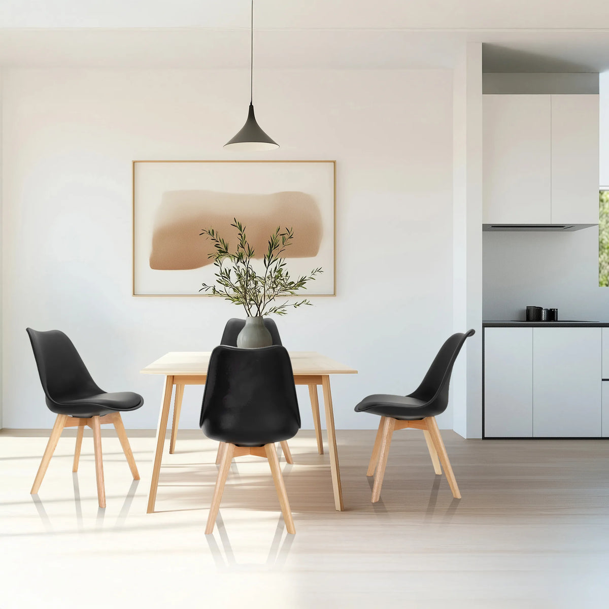 Four black SCANDI 4 shell chairs with wooden legs at a dining table by hjh OFFICE