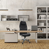 Professional Executive Chair FERRARA in black with headrest and armrests at a desk in the office by hjh OFFICE