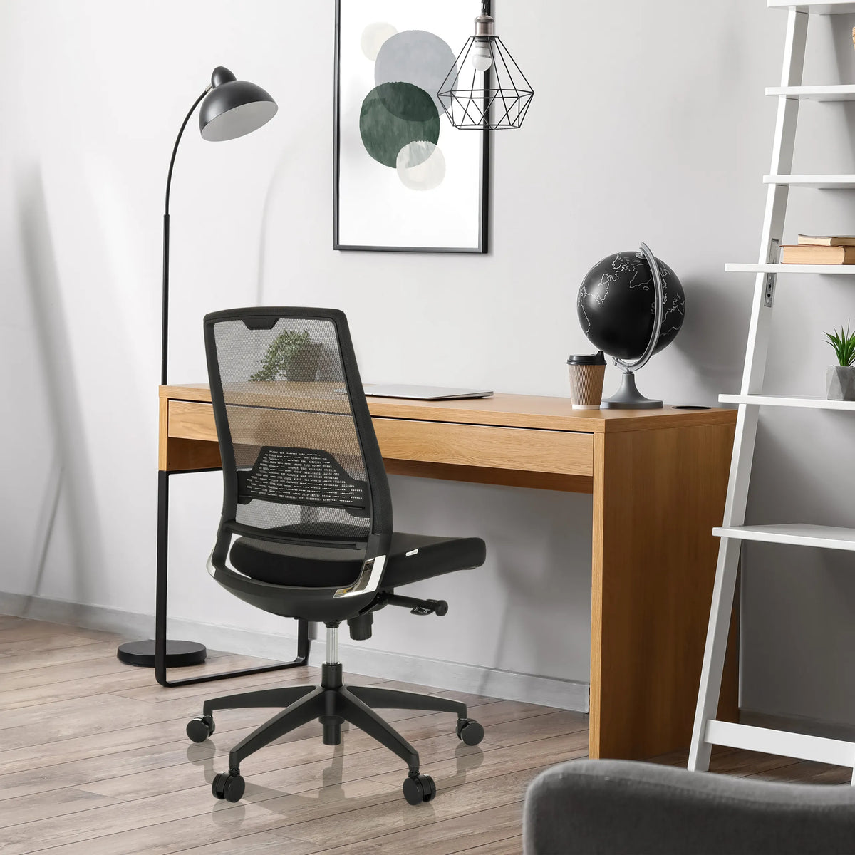 Black Professional Office Chair PORTO ECO I with mesh backrest at a wooden desk by hjh OFFICE