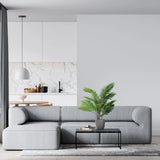 Green artificial plant ARECA in a grey outer pot on a black side table by hjh OFFICE