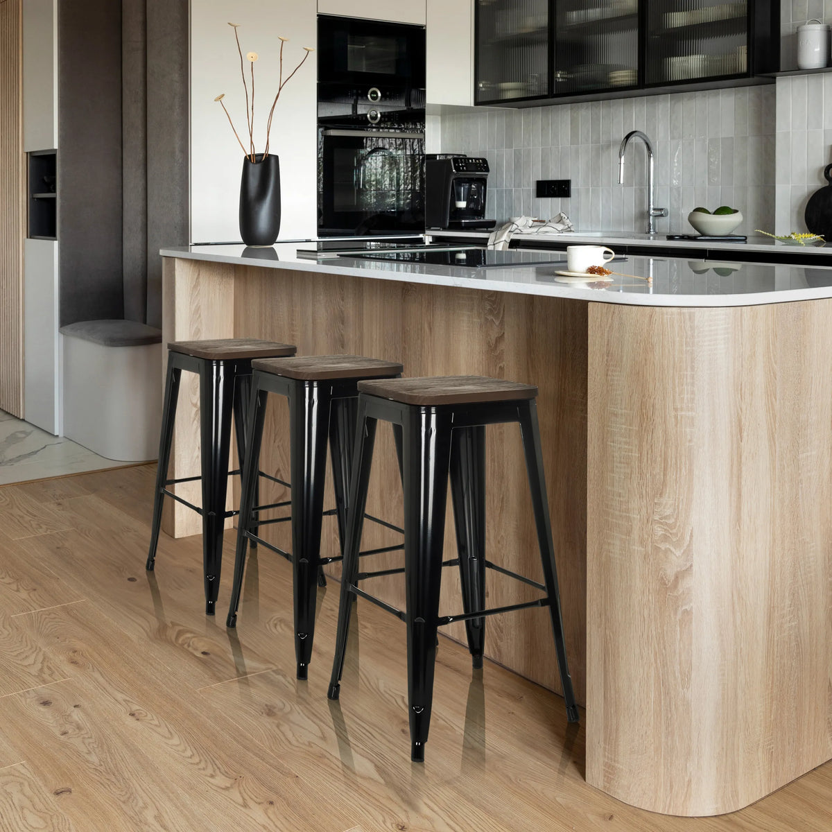 Three black VANTAGGIO HIGH WS bar stools with dark seats at a kitchen island by hjh OFFICE