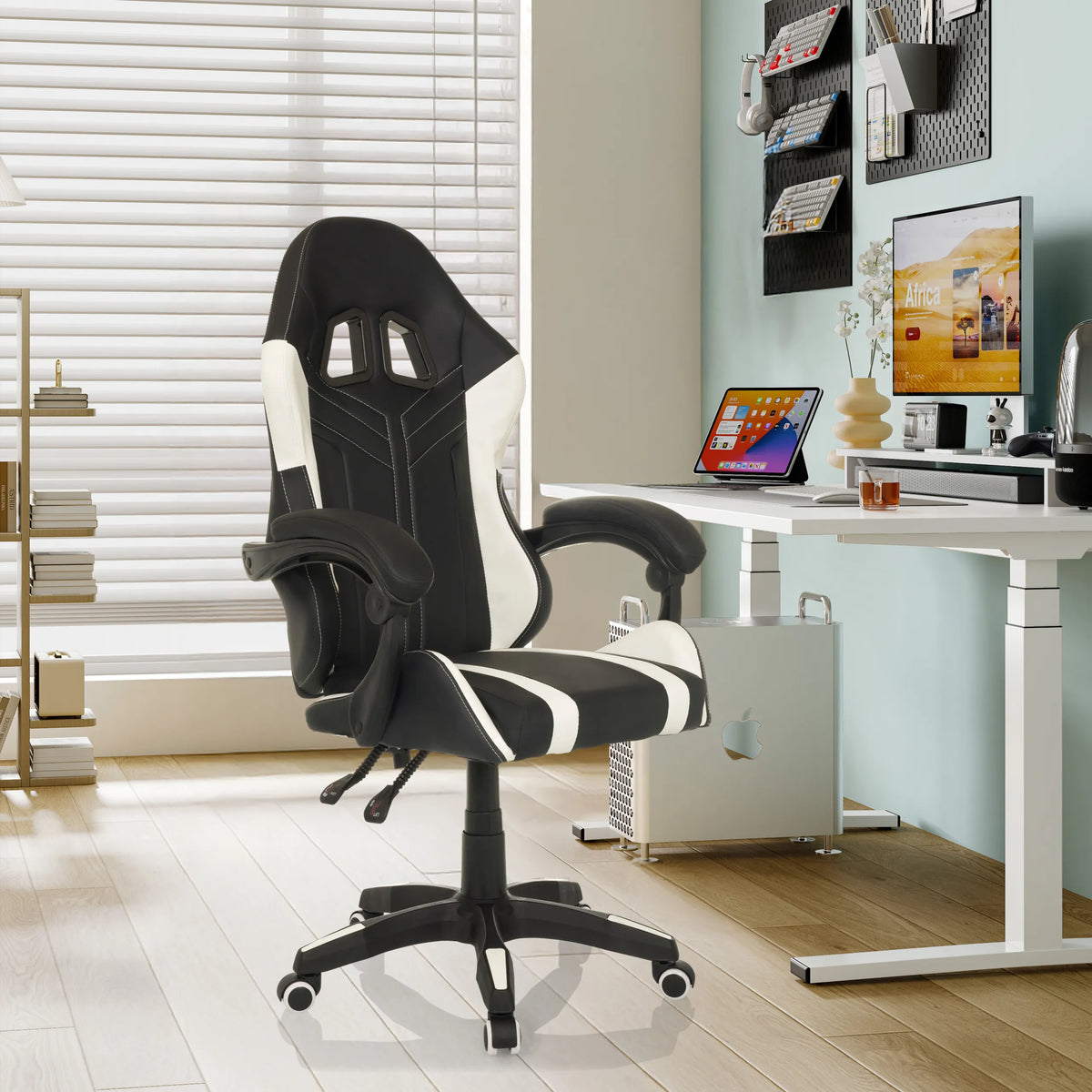 GAMEBREAKER W02 gaming chair in black and white with armrests and castors in a modern home office by MyBuero